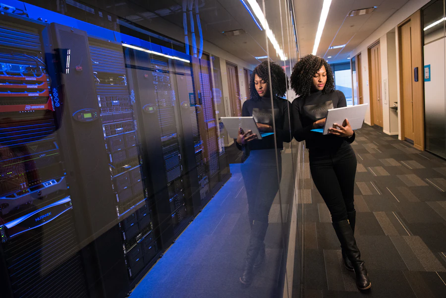 Engineer working beside server racks